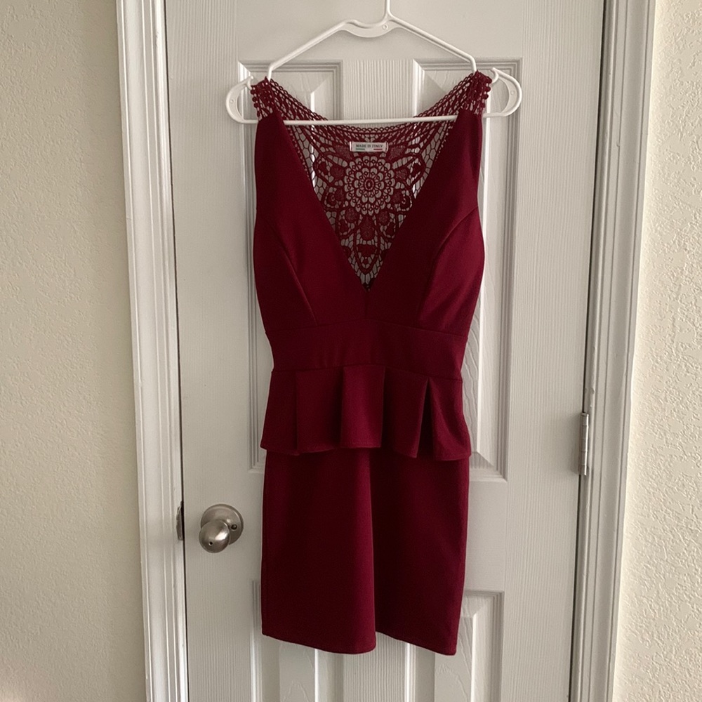 Burgundy mini dress with lace details on the back.